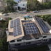 house with several rooftop solar panels